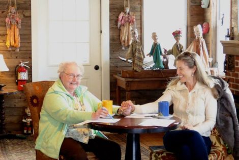 Mother and daughter share a quiet moment at a writing workshop at the Shaker Dam Coffeehouse. Photo: Sandra Walker