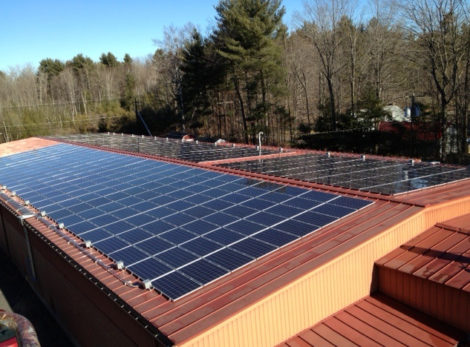A rooftop solar installation on the Caligari Hardware store in Lenox.