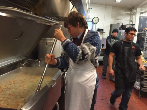 Tristan Gray stirs chicken pot pie filling. Photo: Heather Bellow