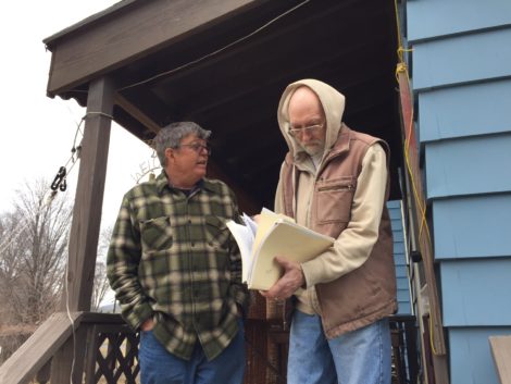 Tim Gray and HRI President Dave Gibbs at his house in the Lakewood District of Pittsfield, looking over the 'scary file.' Photo: Heather Bellow