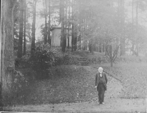 Charles J. Taylor (1824-1904), author of the 1879 'History of Great Barrington,' at the foot of the path leading to his writing cabin. He lived in the South Street house that is now occupied by Finnerty & Stevens Funeral Home. Photo courtesy of the Great Barrington Historical Society.