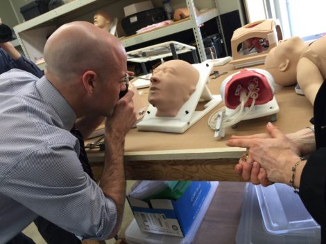 Adam Hinds examines the sinus cavity of a model head.