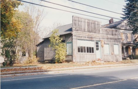 Small retail shops on the north side of Main Street east of the Brown Bridge included this one, which was razed in 1998. (Bernard A. Drew photo 1998)
