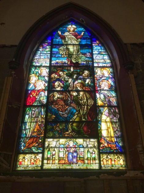 Pointed arch Ascension stained-glass window that has been restored.