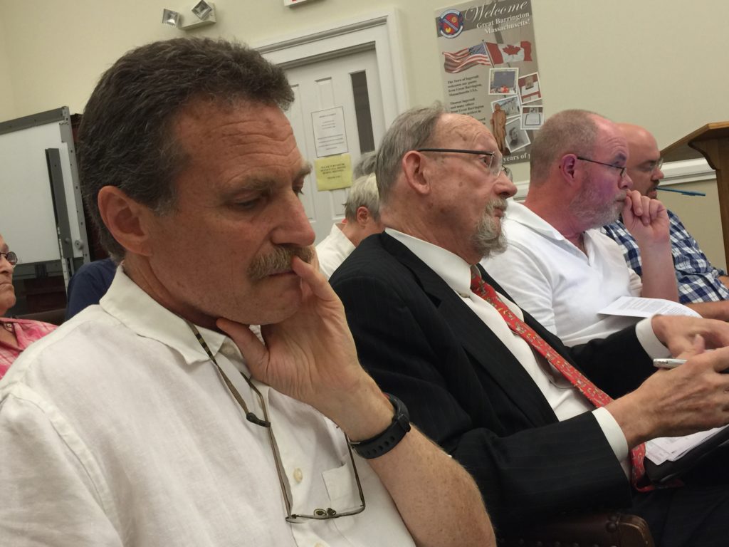 Embattled CDC Executive Director Tim Geller listens while CDC attorney Peter Pucilosky speaks to the board. Photo: Heather Bellow.