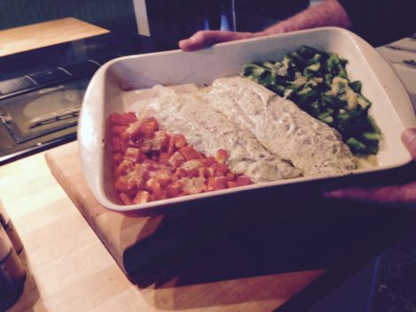 The cod flanked by green and red peppers, ready for baking.