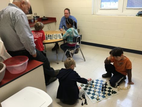 Kalish, left, and Berkshire Hills Superintendent Peter Dillon monitor a match in a double elimination chess tournament at Muddy Brook. Photo: David Scribner