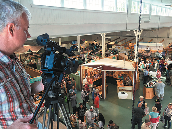 WGBY Executive Producer Dave Fraser gathers footage of the 2016 Big E for "100 Years on the Avenue: The Story of the Big E."