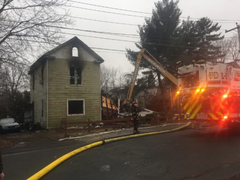 By Sunday afternoon, a crane from Wilkinson Construction had arrive to begin the structure's demolition. Photo: Scott Christianson