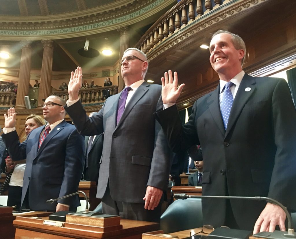 Rep. William "Smitty" Pignatelli, right, takes his oath of office on Wednesday, Jan. 4, joined by colleagues, from left, Rep. Frank Moran, D-Lawrence, and Rep. Stephen Hay, D-Fitchburg.