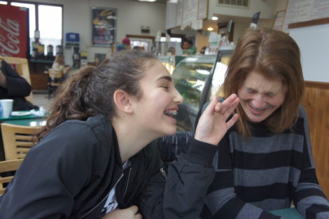 Maisy and Tracy break into laughter. Photo: Hannah Barrett