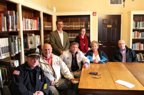 Those involved in the project and attended the viewing at the Mason Library are, front, from left, Police Chief Bill Walsh, town veterans' graves officer Andy Moro, past VFW commander Mike Murphy and district veterans agent Laurie Hils. Back row: Selectman Ed Abrahams and Mason Library Director Amanda M. DeGiorgis. Photo: Terry Cowgill