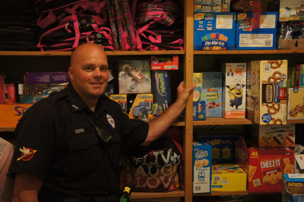 Officer Derby has a collection of snacks in the basement of the Pittsfield Police Department that he hands out to neighborhood children.