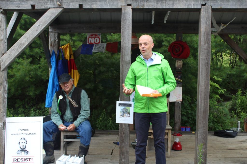 Sen. Adam Hinds has words of encouragement and some criticism for state and federal officials. Sugar Shack Alliance member Will Elwell is at left. Photo: Terry Cowgill