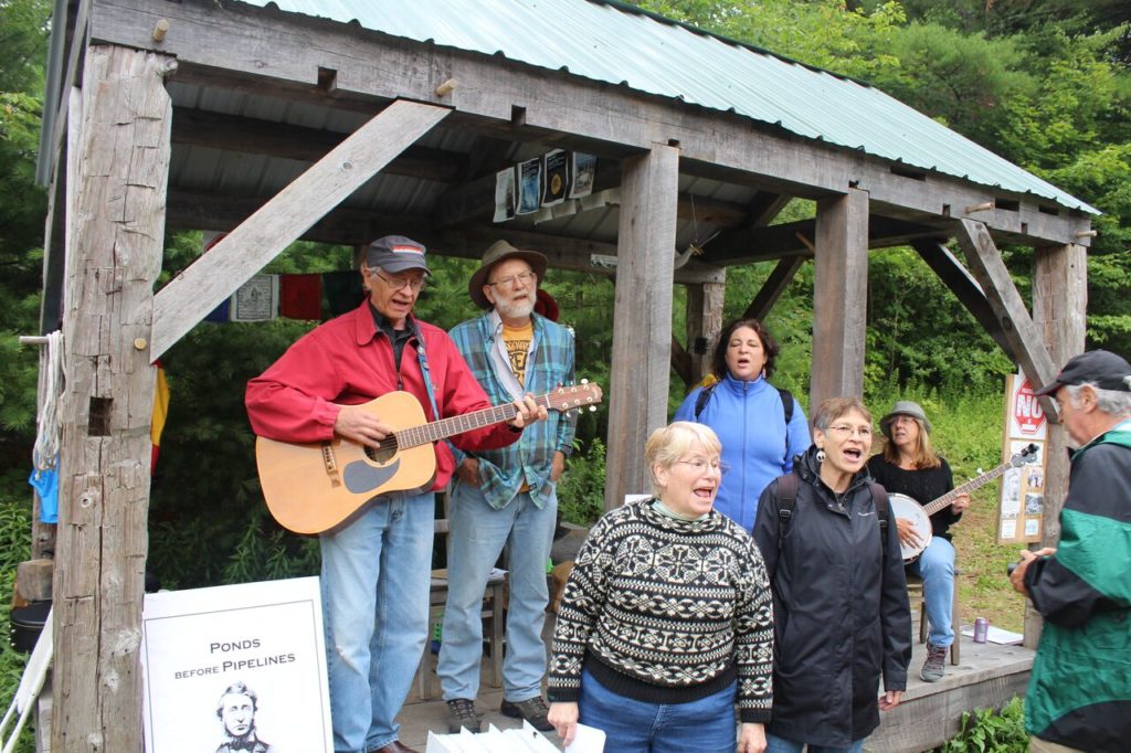 Led by Graham Dean on guitar, the Hoping Machine singers perform "If I Had a Hammer." Photo: Terry Cowgill
