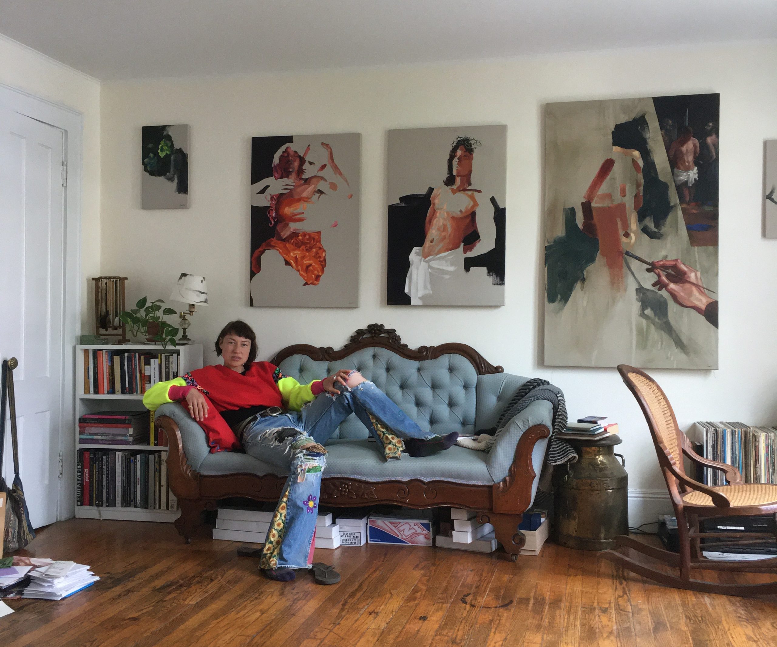 Chalice Mitchell with her paintings.