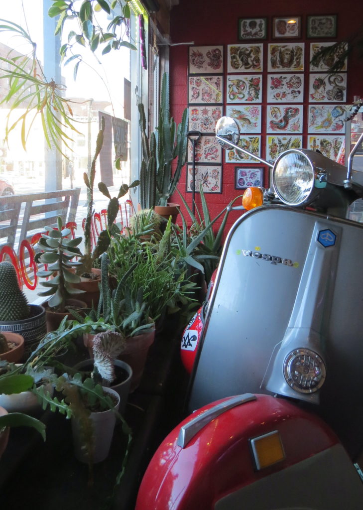 Front window of Lucky Cat Tattoo in North Adams, Mass.