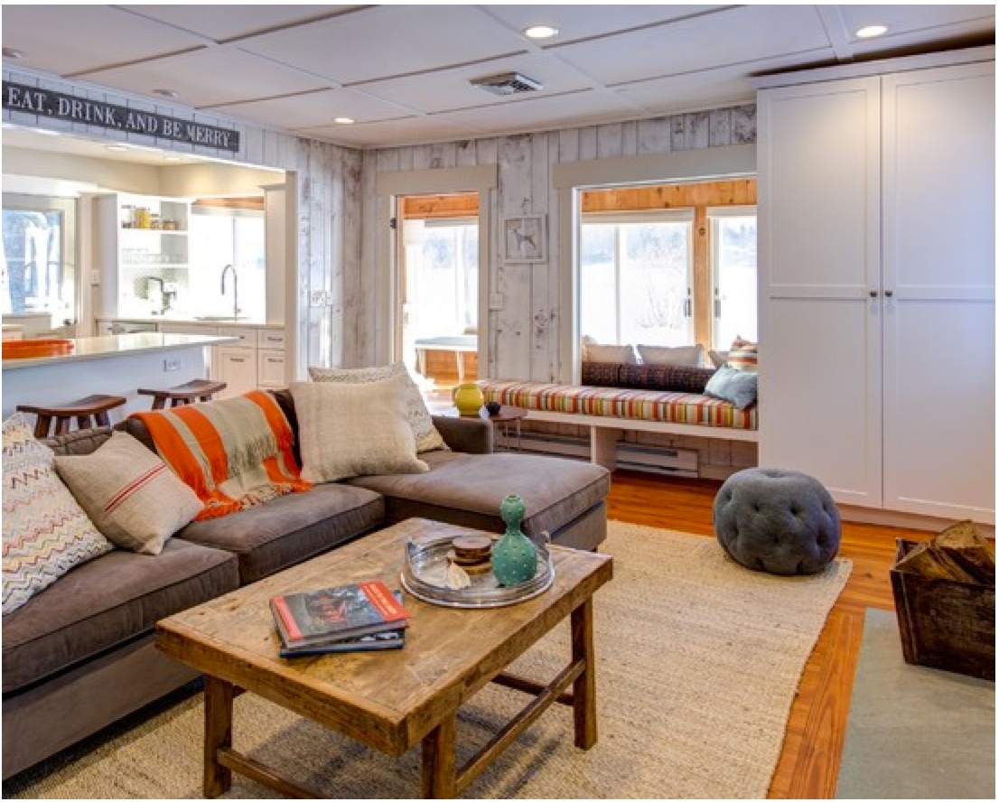 The new living room: light walls and a bench with storage.