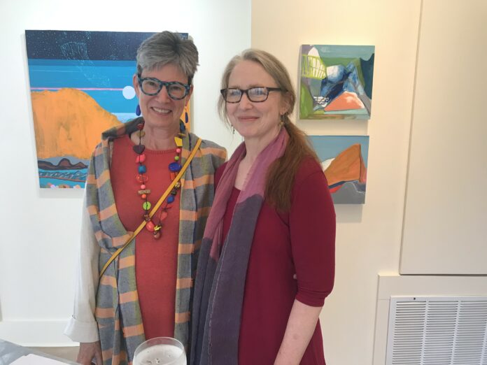 Jan Conn, in front of her painting 