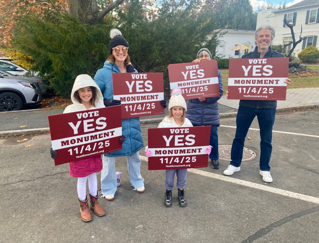 Supporters of the Monument Mountain proposal in Stockbridge brave a windy, chilly November 4 to make their stance known. Photo by Leslee Bassman.