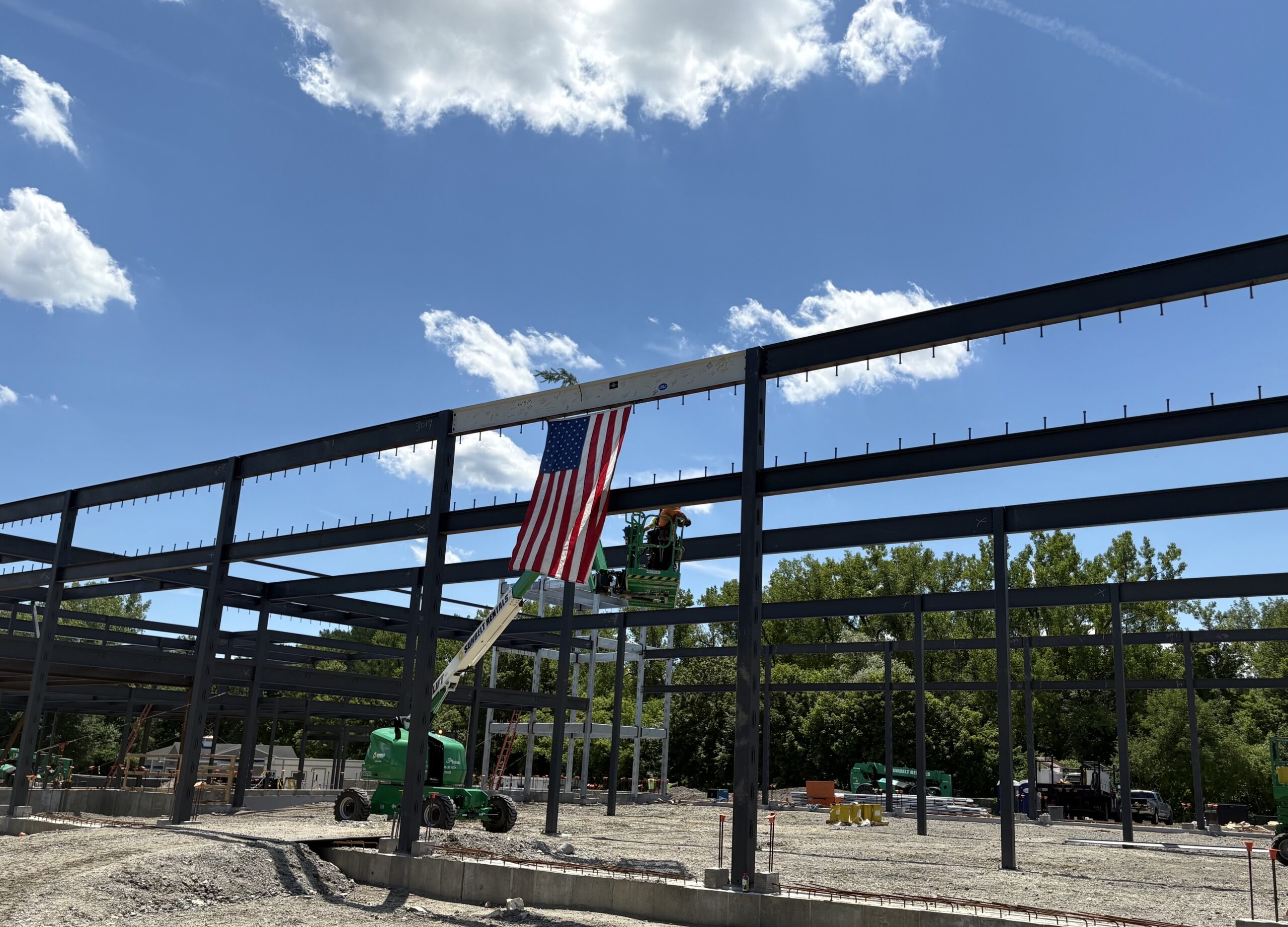 Beam me up: Lee stakeholders celebrate as the final beam is placed atop the town’s new Public Safety Building - The Berkshire Edge